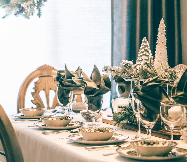 a table setting with a chandelier and a chandelier