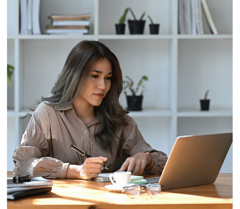 a computer user sitting at a desk learning new cybersecurity skills with Lümee awareness platform