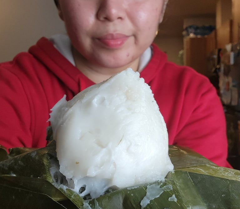 a woman holding a large piece of food in her hands
