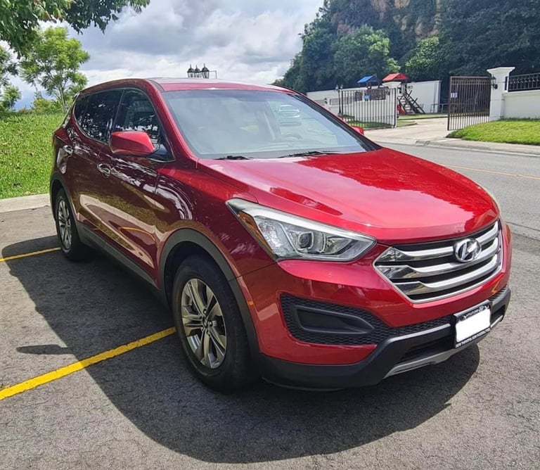 a red car parked in a parking lot