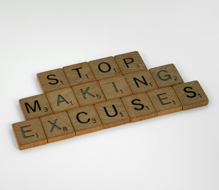 a wooden block with words that spell out the word stop making excuses