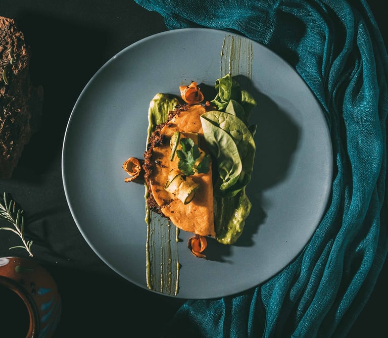 a plate of food with a taco on it