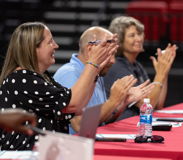 judges applaud students after a main stage presentation