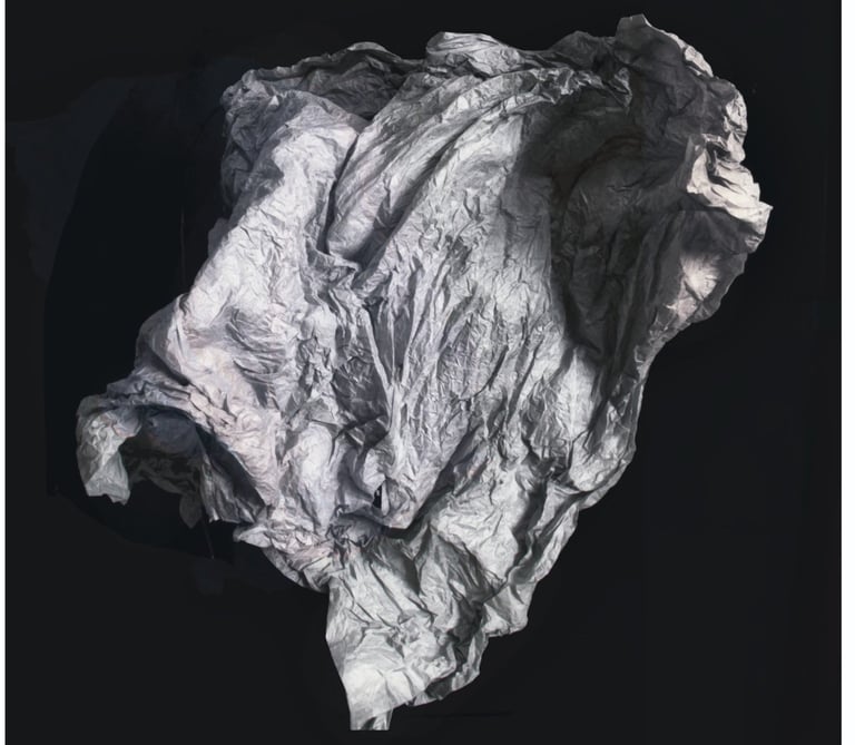 An abstarct photo of a sheet or membrane floating in a black space