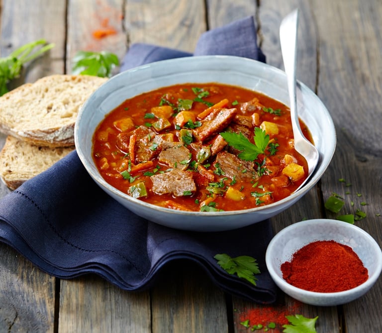 a bowl of soup with a spoon and a spoon in it