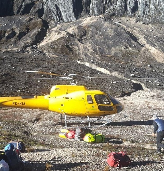 a helicopter landing at Yellow Valley Base camp Carstensz Pyramid