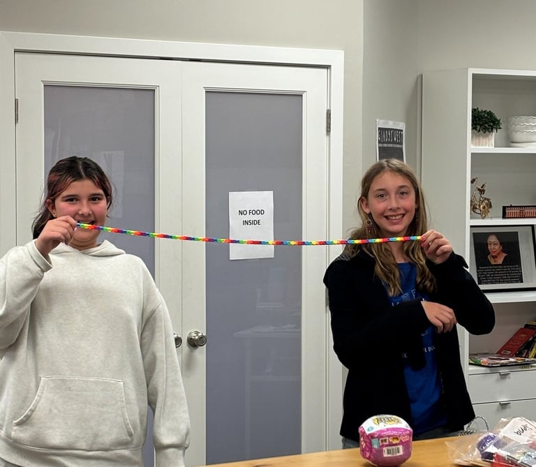 girls doing fun math activity.