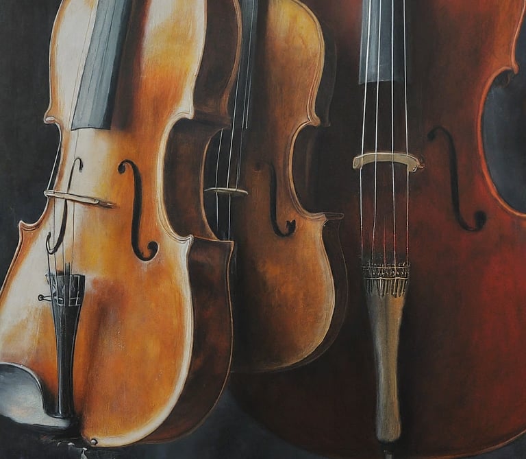 An image of a viola, violin, and cello together.