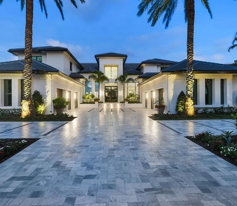 a large house with a driveway leading to a large driveway