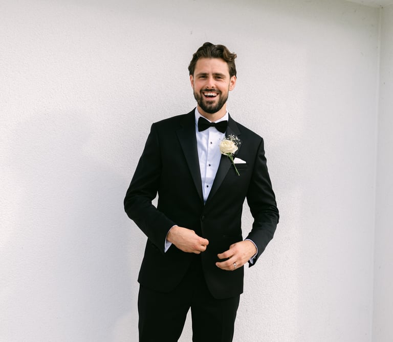Groom smiling at wedding at The Shenley Club, London