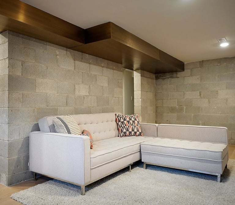 Home interior brass air vent above a couch, made by Pengelly Iron Works