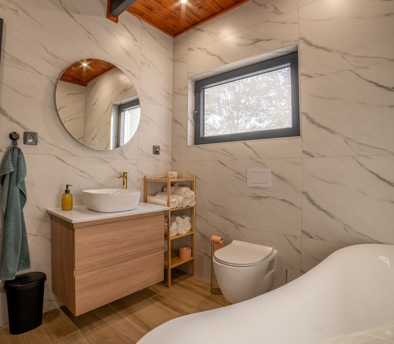 a bathroom with a tub tub and a wooden ceiling