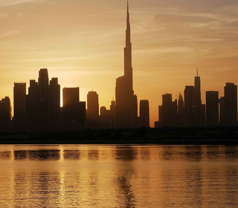 Dubai skyline with Burj Khalifa at sunset, symbolizing real estate consulting and investment strategy in the UAE.