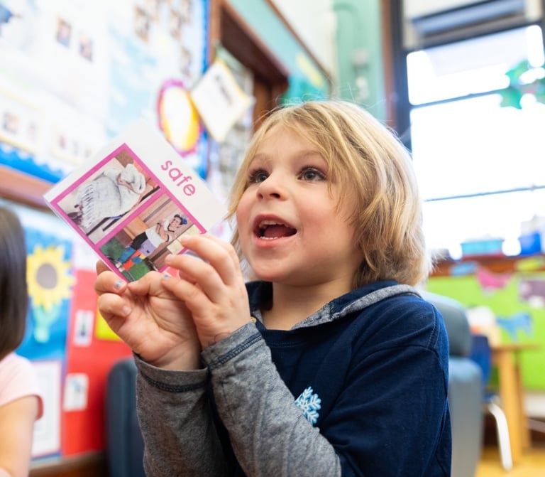 boy engaging with oopa movement card