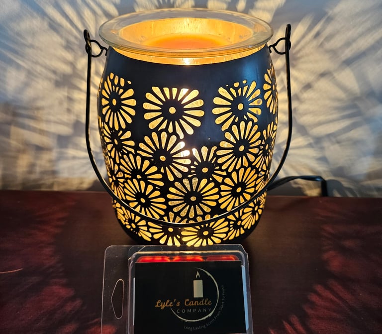 a candle lit up with a candle in a glass jar
