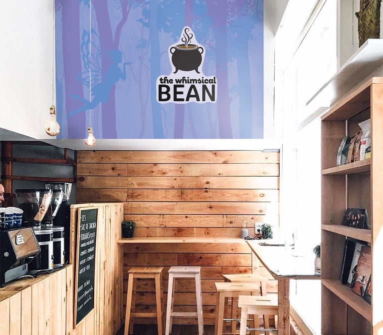 Coffee shop with custom logo wall design
