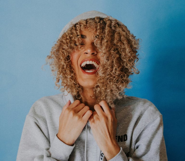 Smiling woman with a blue background