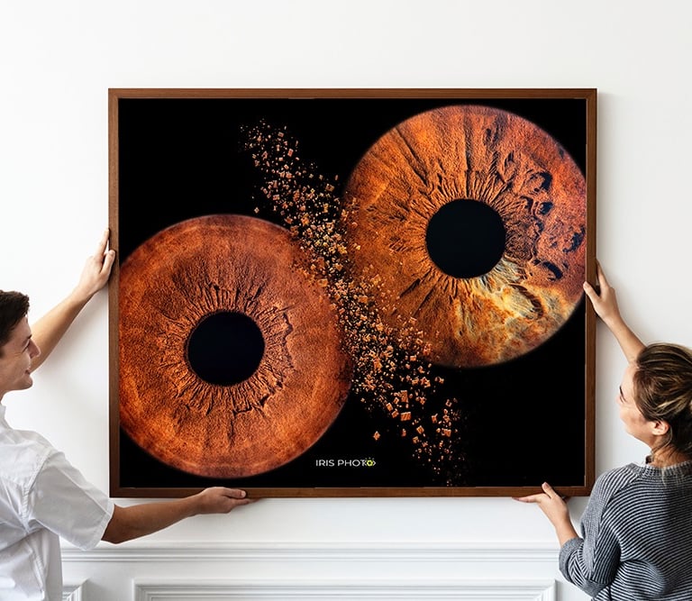 a man and woman holding a large eyeball
