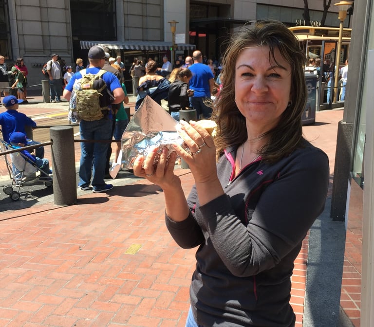 Tracey is holding a hot dog