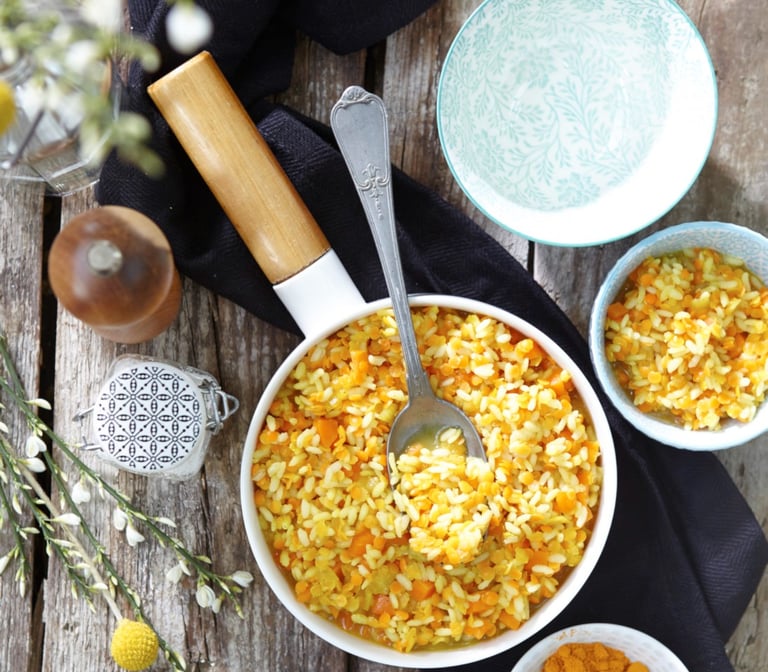 a bowl of food with a spoon and a spoon in it