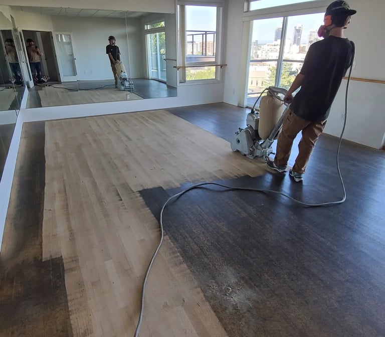 a maple floor that has been heavily damaged by tap dance shoes