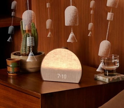 Hatch Restore 3 sunrise alarm clock with glowing light.