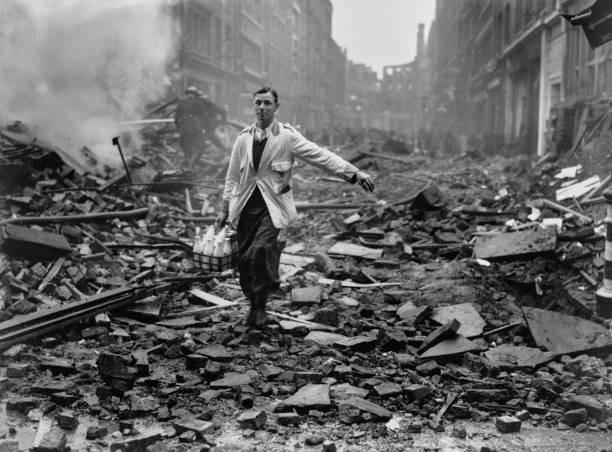 A milkman delivers glass bottles through London rubble during the World War II Blitz.