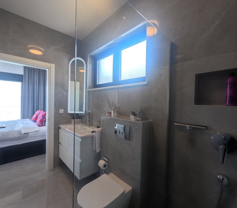 Villa Fay master bathroom with a toilet and a shower