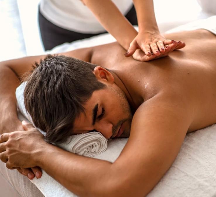 Deep tissue massage therapy targeting muscle knots and chronic tension in a professional spa setting
