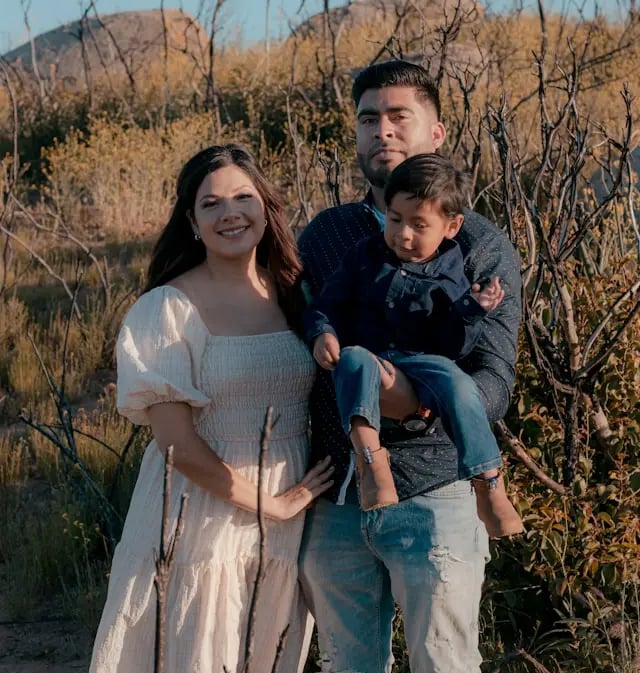 young Hispanic family in a field