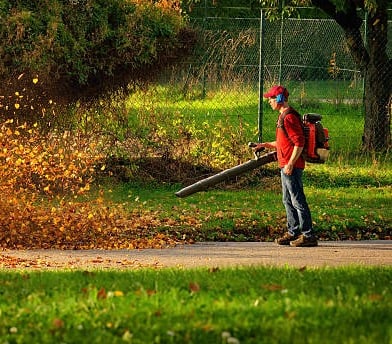 guy blowing leaves