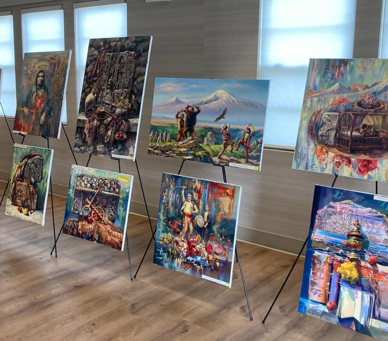 Collection of original oil paintings by Meruzhan Khachatryan displayed on easels in an exhibition st