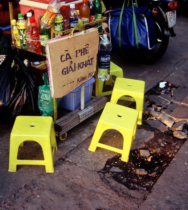 Plastic chairs in Saigon on a pavement coffee stall