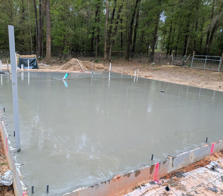 Concrete slab installation in Pensacola FL with fresh poured concrete and reinforced edges