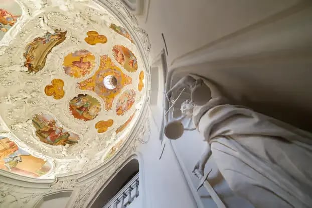 Intricate baroque ceiling art in a historic building during a Graz private walking tour.