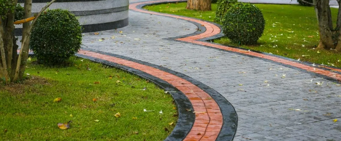 a red and clack concrete walkway
