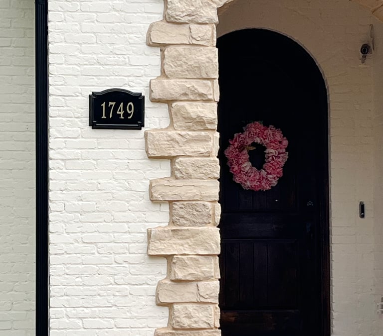 Exterior painting detail of a home in Washington Park, Denver. Features crisp white painted brick c