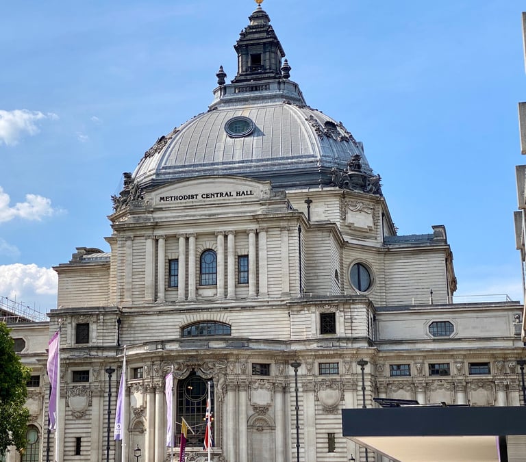 a large portland stone building with a dome shaped roof made of lead