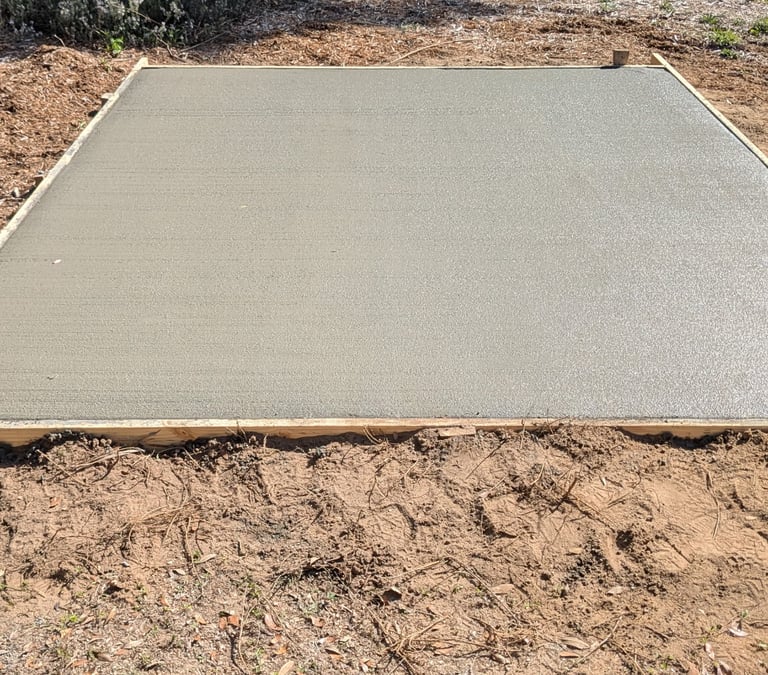 Smooth concrete slab foundation in Pensacola FL with clean professional finish