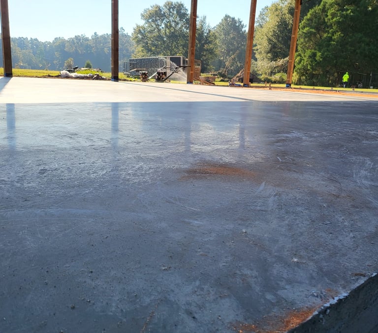 Newly poured concrete parking lot in Pensacola FL with clean, level surface