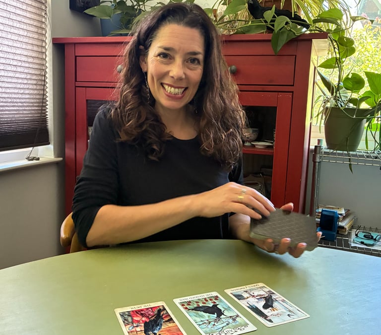 Picture of Colleen smiling and laying out cards