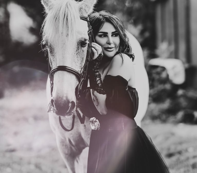 Black and white portrait of model with white horse, captured by Fred Art Studio.