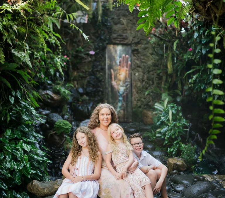 Family portrait near the hidden waterfall garden at Umbul Sari in Ubud Bali