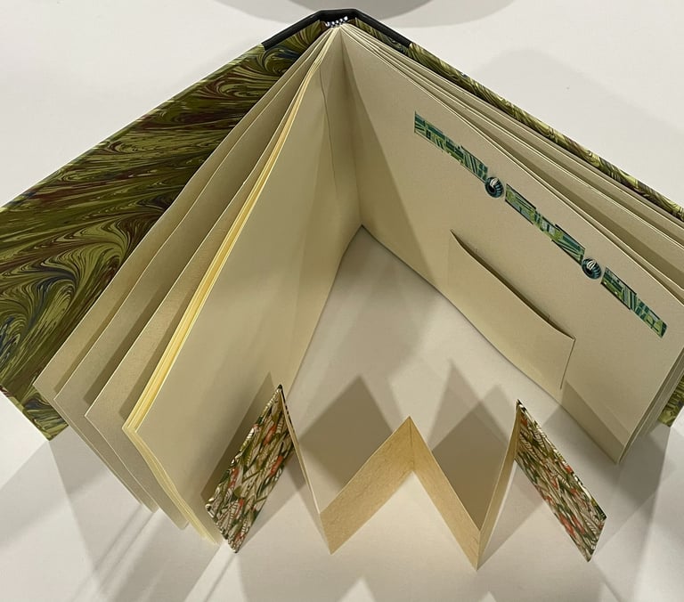 Album with marbled paper and decorative pages