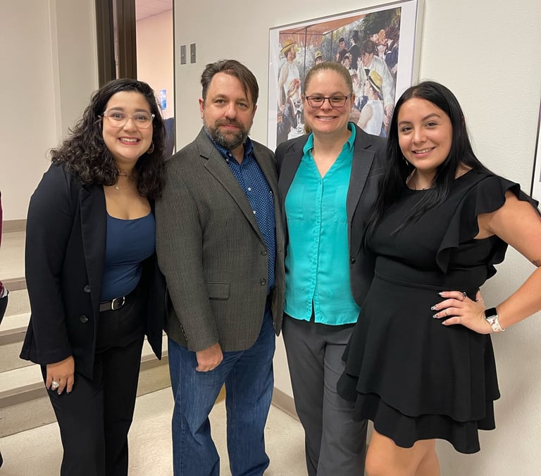 Dr. Hooton and Dr. Jason Pierce (center) with History Society leadership at their book launch event