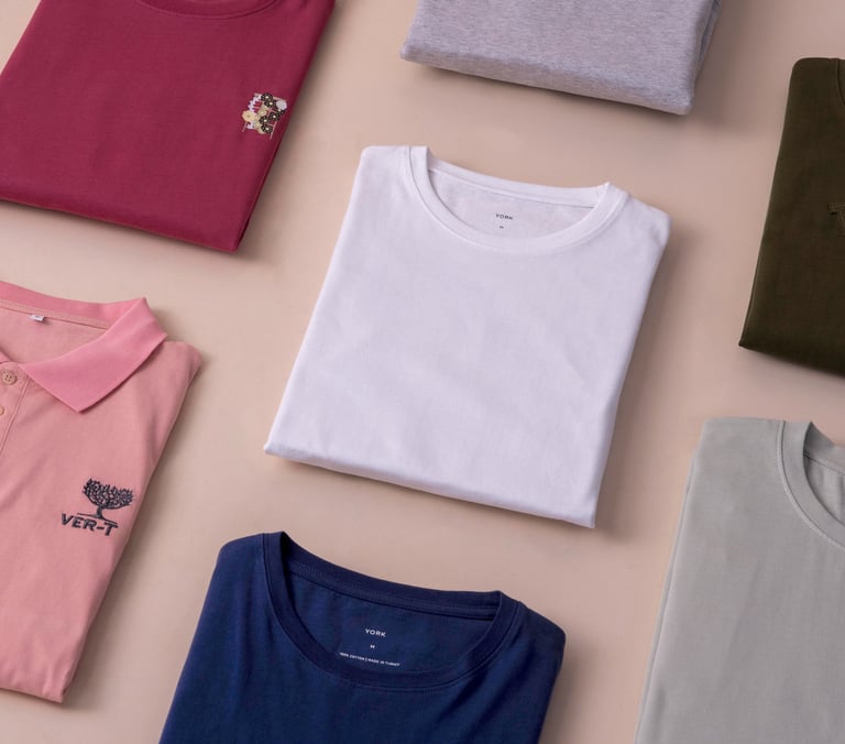a variety of t - shirts and polo shirts