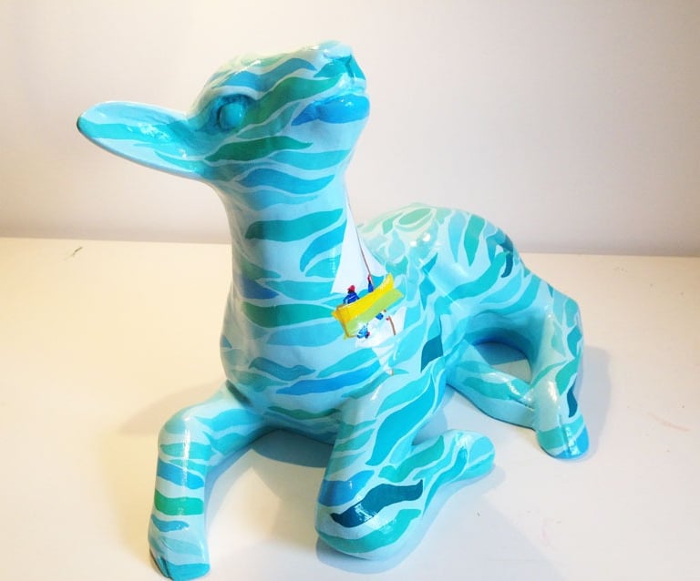 Small sculpture of a lamb featuring a Swallows and Amazons design by Laura Fearn
