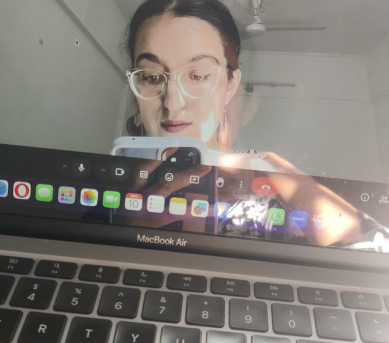 Riya taking a picture of her laptop screen