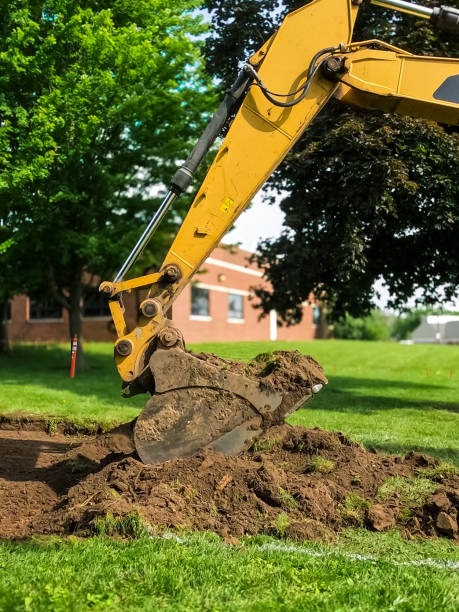 excavator breaking up land