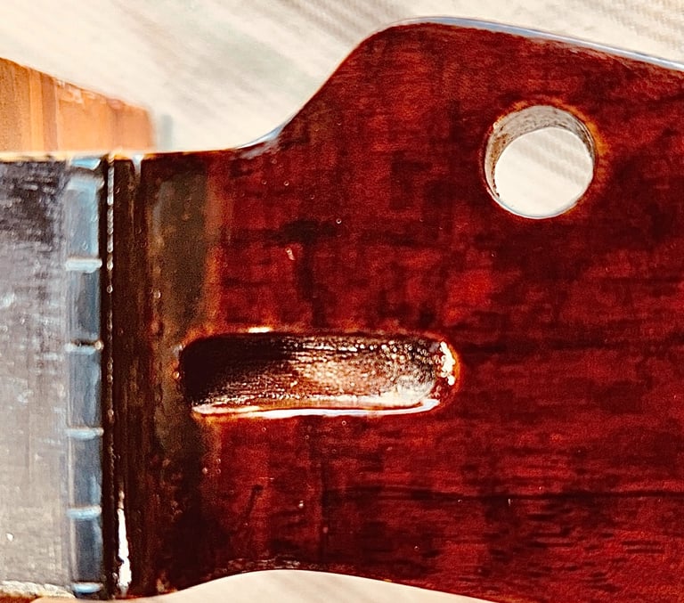 Magnified Repair after many layers of colors and finish have been applied